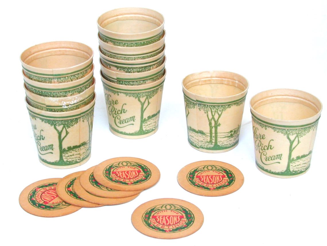 Cream cartons decorated with a holly pattern